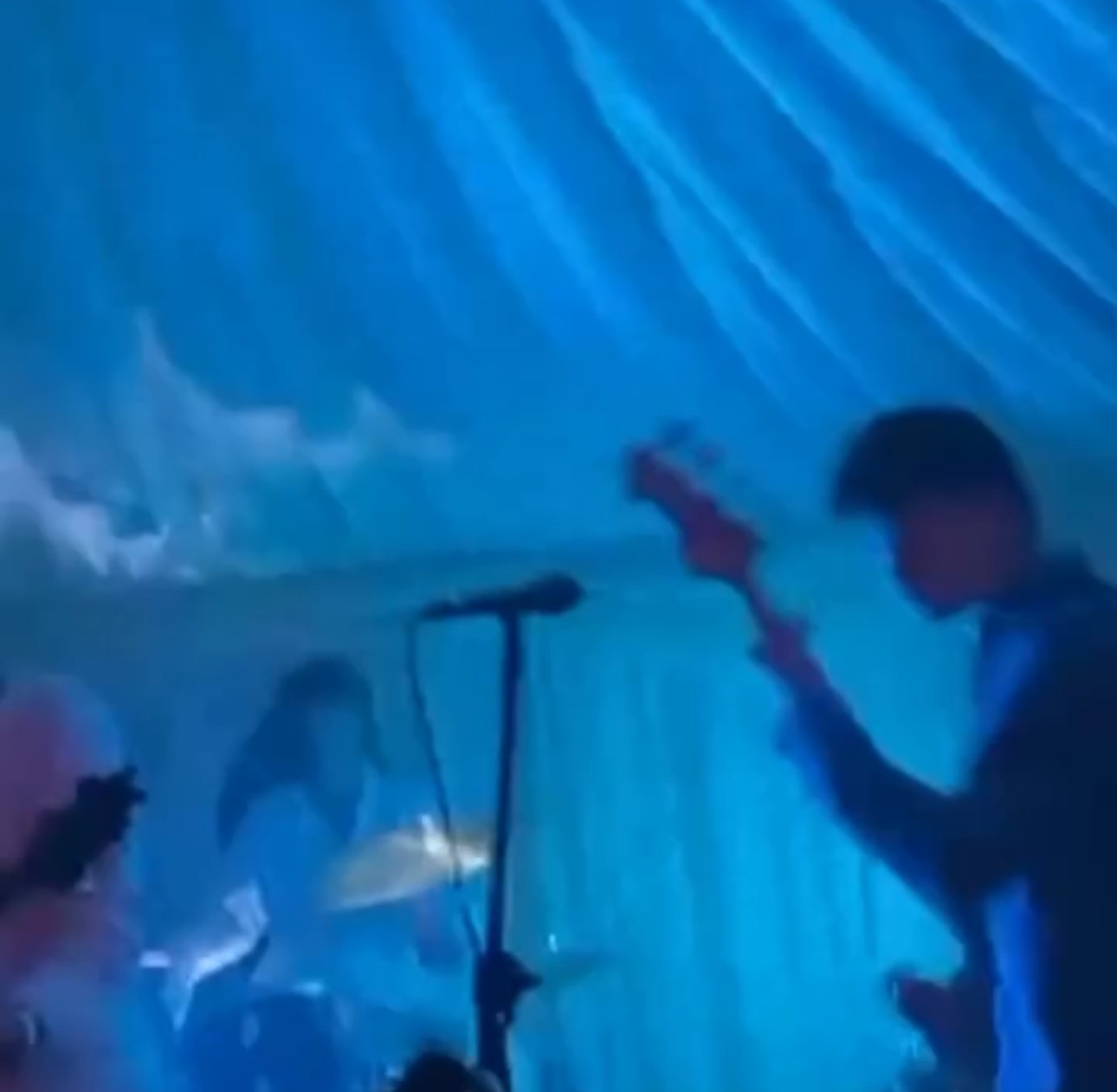 Driveblind performing live show with crowd engagement and indie music atmosphere